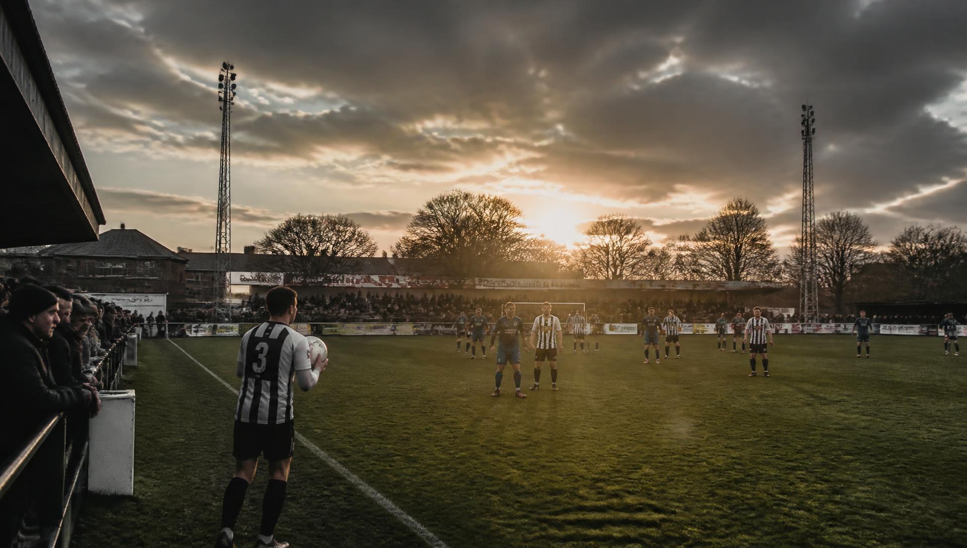 Wandering Crows charity football match under floodlights